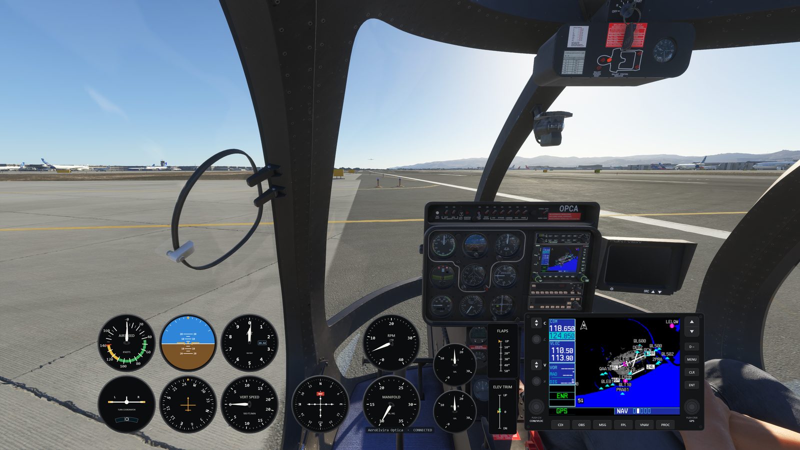 Analog gauge cluster and live GNS 530 map in the Optica